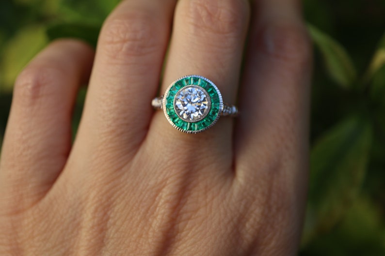 Art Deco Inspired Diamond and Colombian Emerald Halo Ring in 18k White Gold